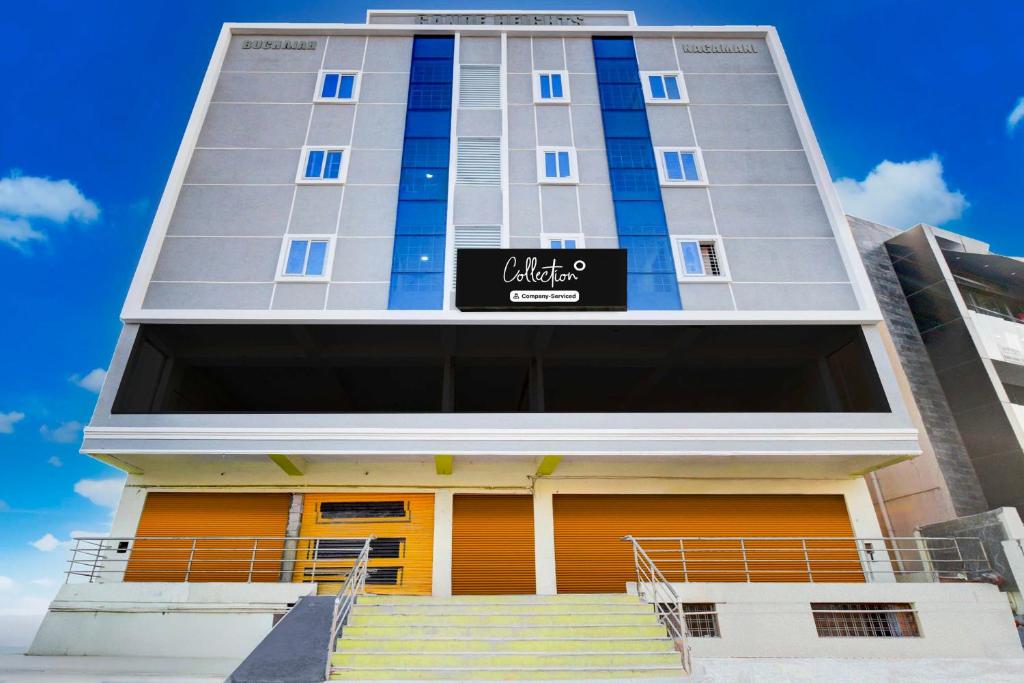 a tall building with stairs in front of it at Townhouse Oak LB Nagar Metro Station in Hyderabad