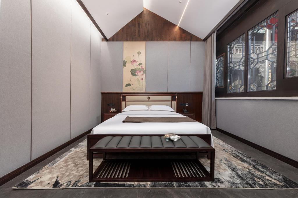 Postel nebo postele na pokoji v ubytování Tao Hotel