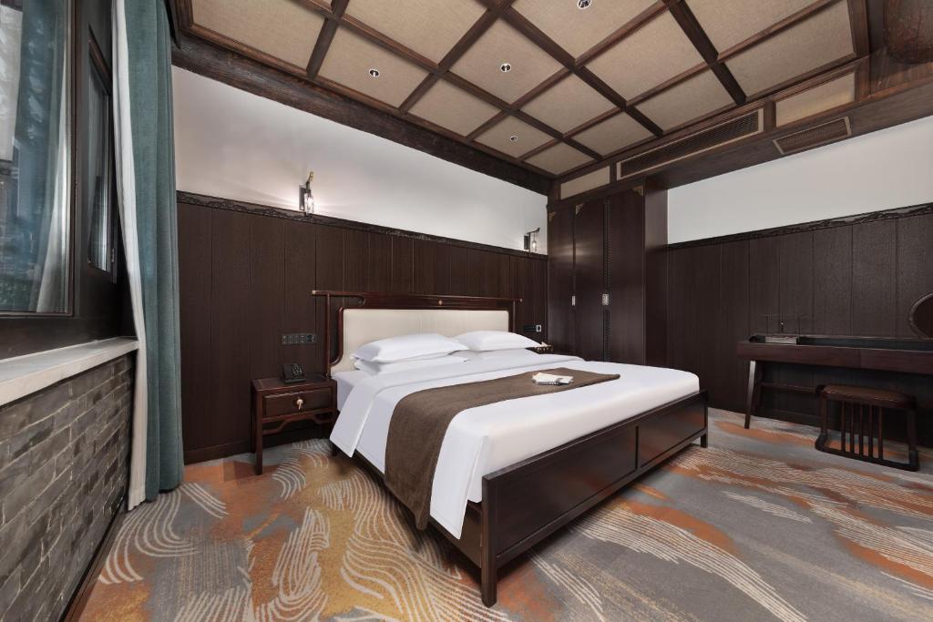Postel nebo postele na pokoji v ubytování Tao Hotel