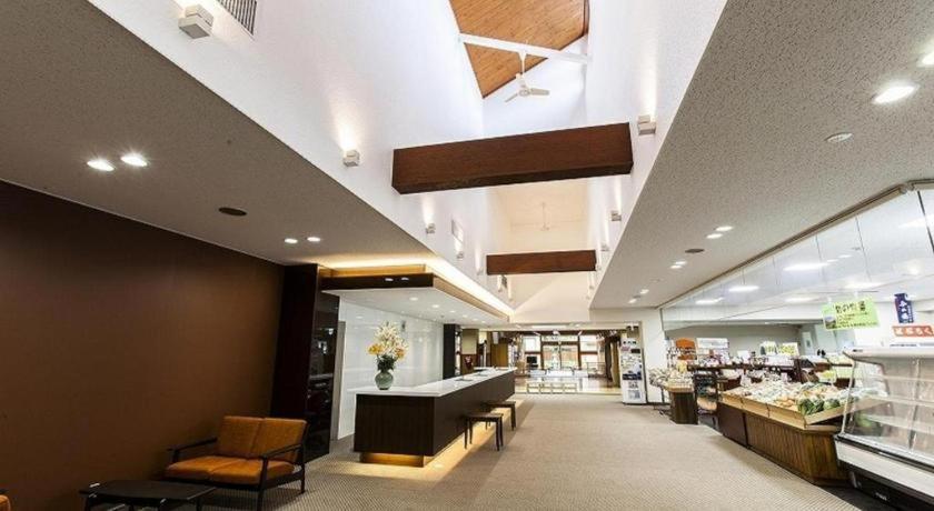 a shopping mall with a flower department and a store at Hotel Silk Onsen Yamabiko in Izushi