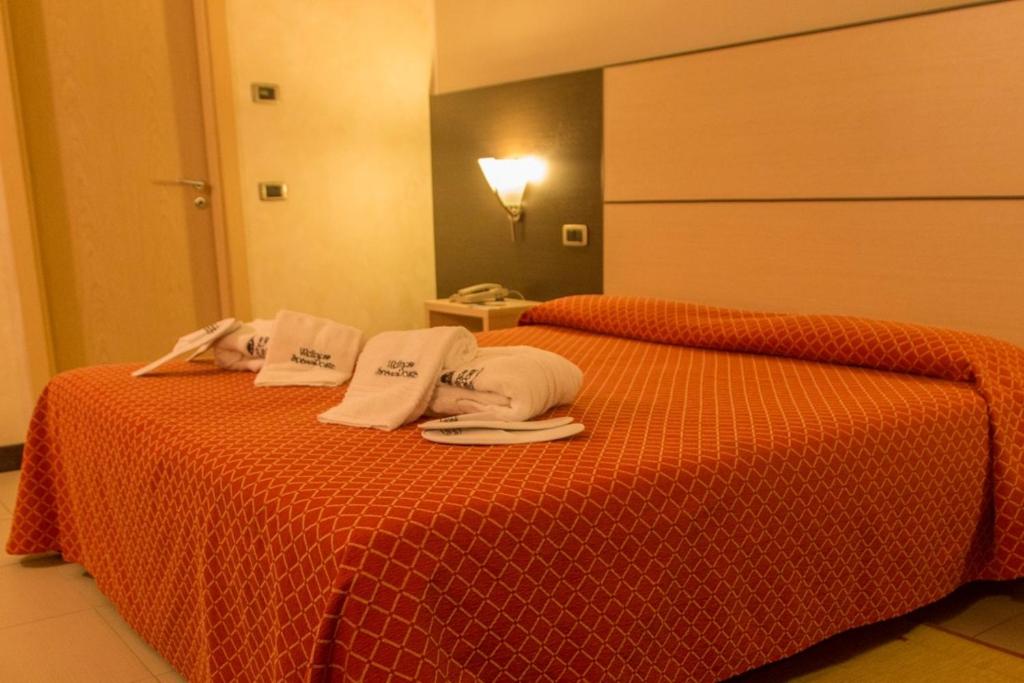 Postel nebo postele na pokoji v ubytování Albergo della Posta