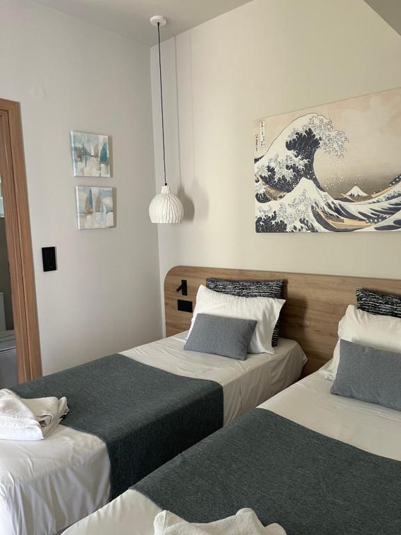 Postel nebo postele na pokoji v ubytování Psaras Apartments