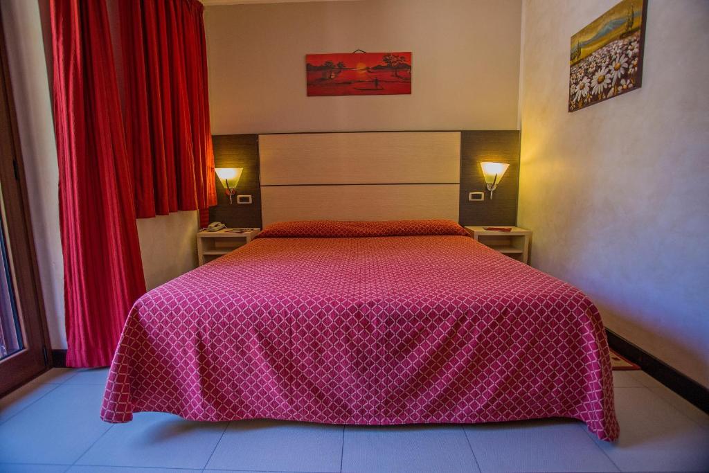 Postel nebo postele na pokoji v ubytování Albergo della Posta