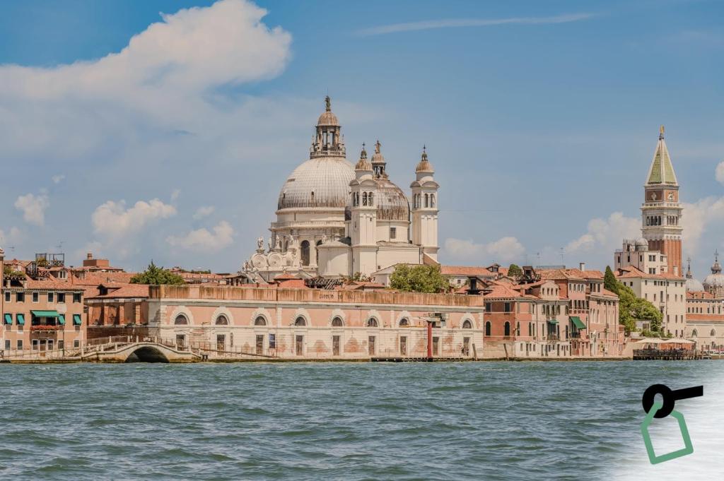 a view of a building from the water at Hotiday Venezia Cape in Venice