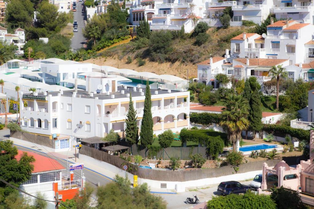 an aerial view of a city with houses at AT Almoraide Rooms Suites in Nerja