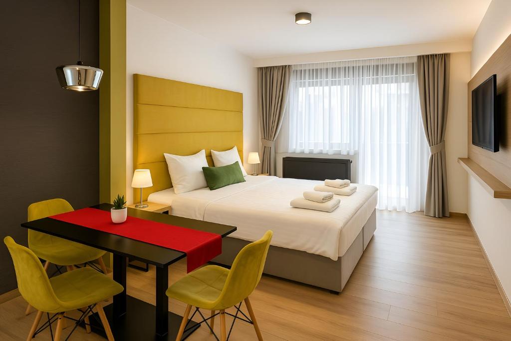 Postel nebo postele na pokoji v ubytování Apex Apartman Sárvár