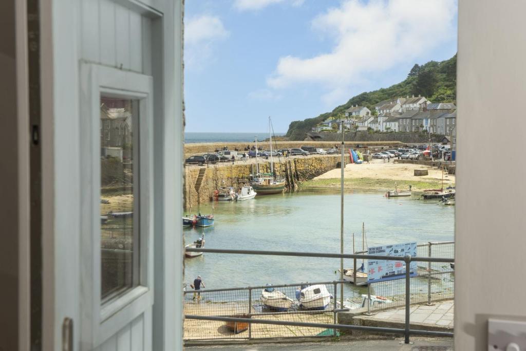 a view from a window of a marina at Berlewen, Mousehole in Mousehole