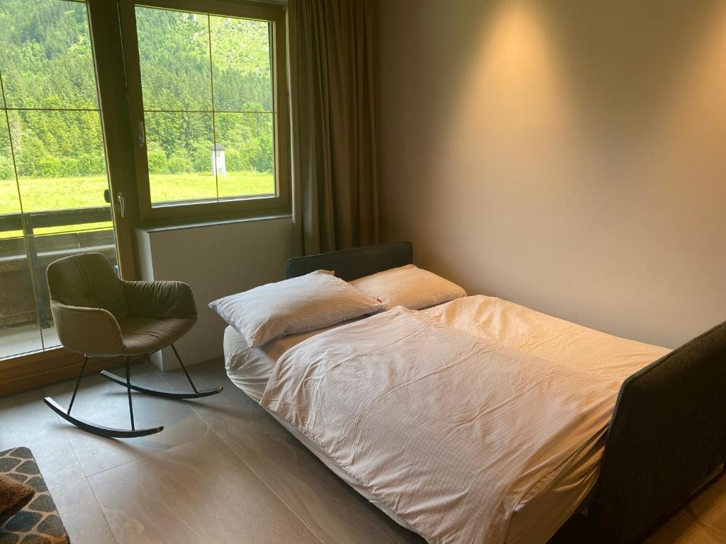 Postel nebo postele na pokoji v ubytování Kleines Chalet Hinterstoder