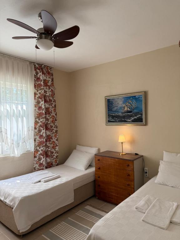 Postel nebo postele na pokoji v ubytování Idil Apart-Datça