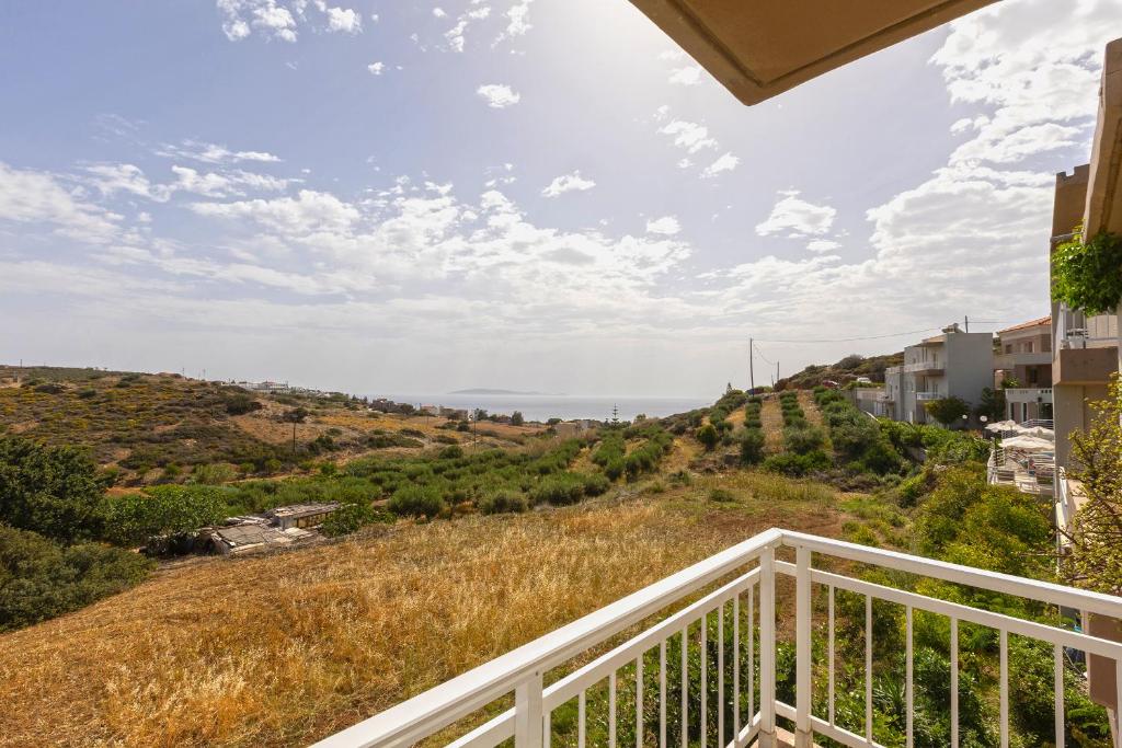 a view of the ocean from the balcony of a house at Pelagia Bay Hotel in Agia Pelagia