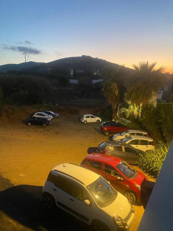 a group of cars parked in a parking lot at Pelagia Bay Hotel in Agia Pelagia
