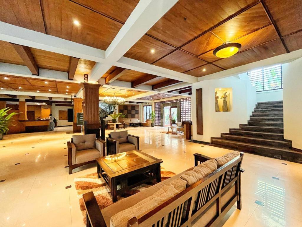 a large living room with a couch and a table at HOTEL SARI KURING INDAH in Cilegon