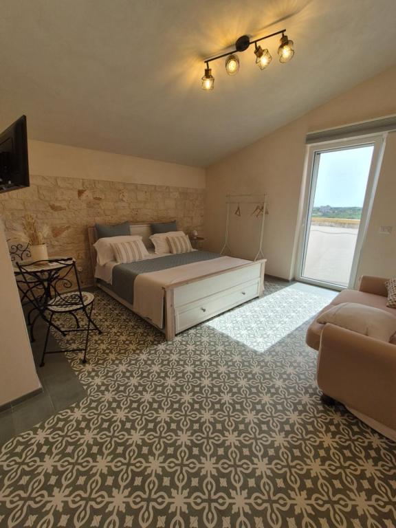 Postel nebo postele na pokoji v ubytování Il Trullo di Nonna Lella