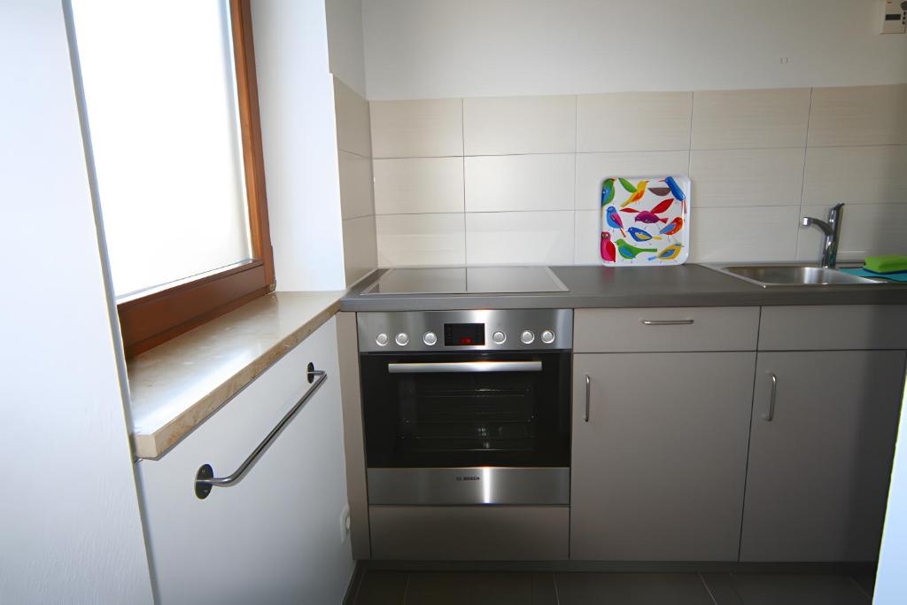 Kuchyň nebo kuchyňský kout v ubytování Gästehaus Perlmuschel