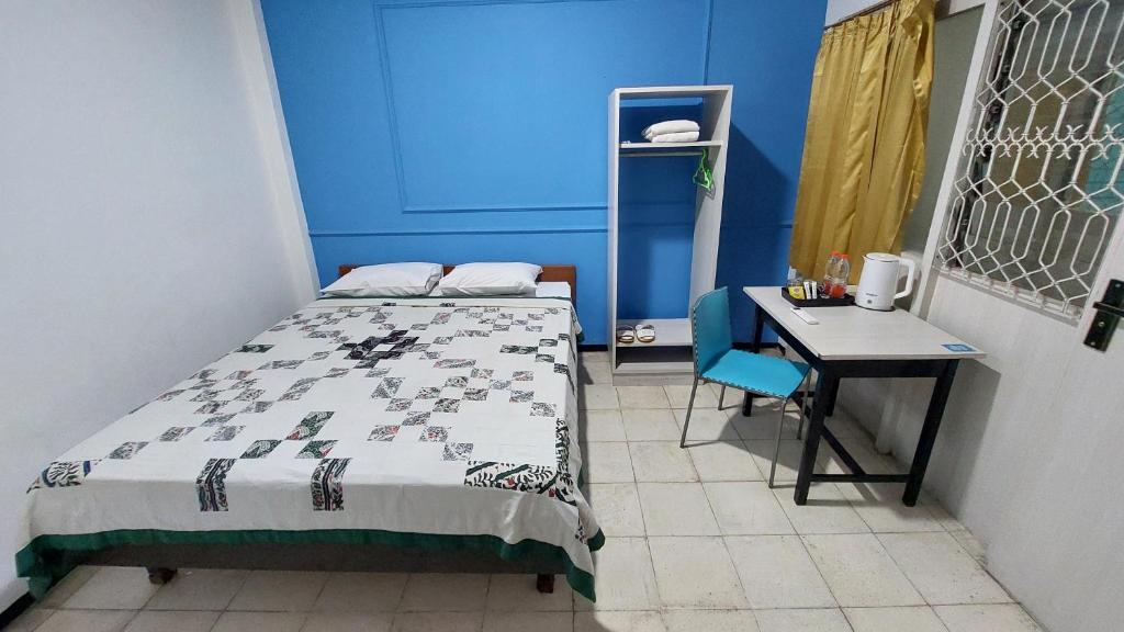Postel nebo postele na pokoji v ubytování Riche Heritage Hotel