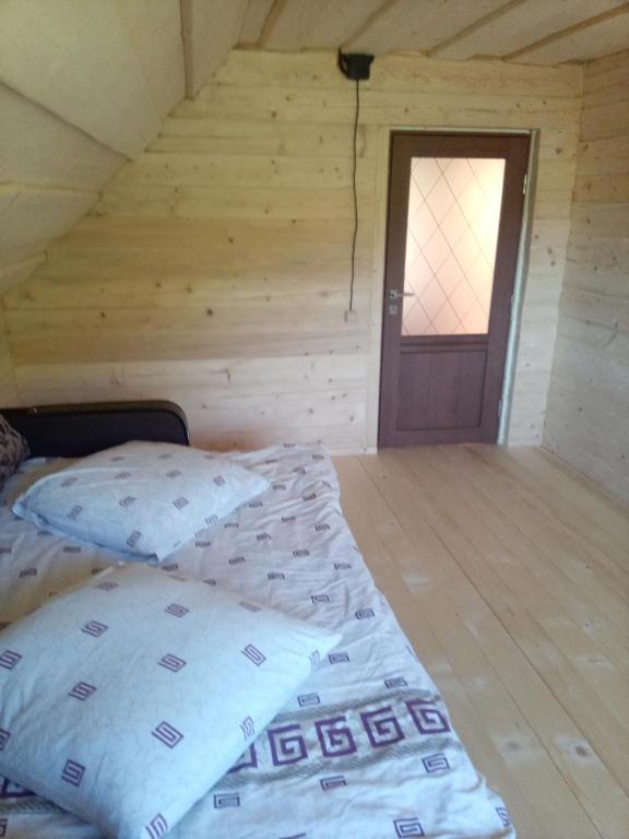 Postel nebo postele na pokoji v ubytování Sadyba u Vani