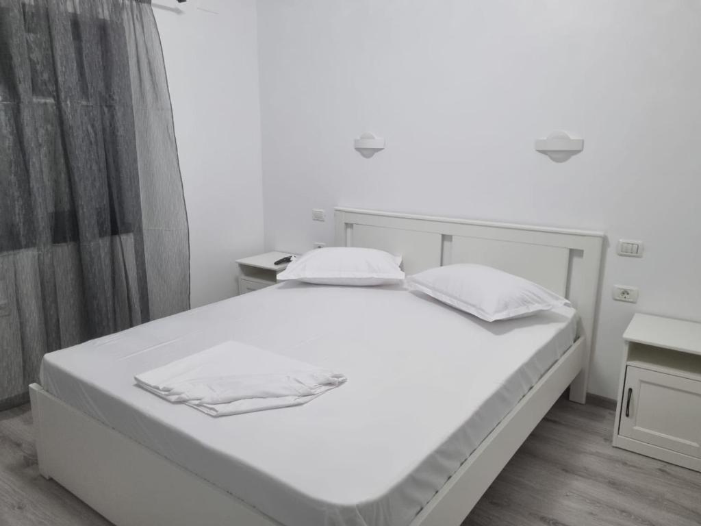 Postel nebo postele na pokoji v ubytování Casa Mihai