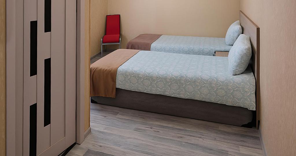 Postel nebo postele na pokoji v ubytování Lime Hotel & Restaurant Complex