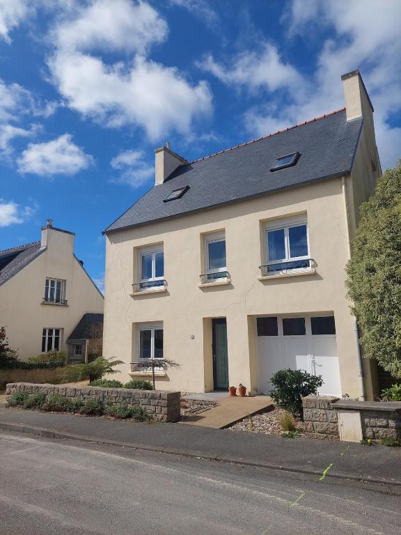 a white house on the side of a street at Maison Maurice Quimper in Quimper