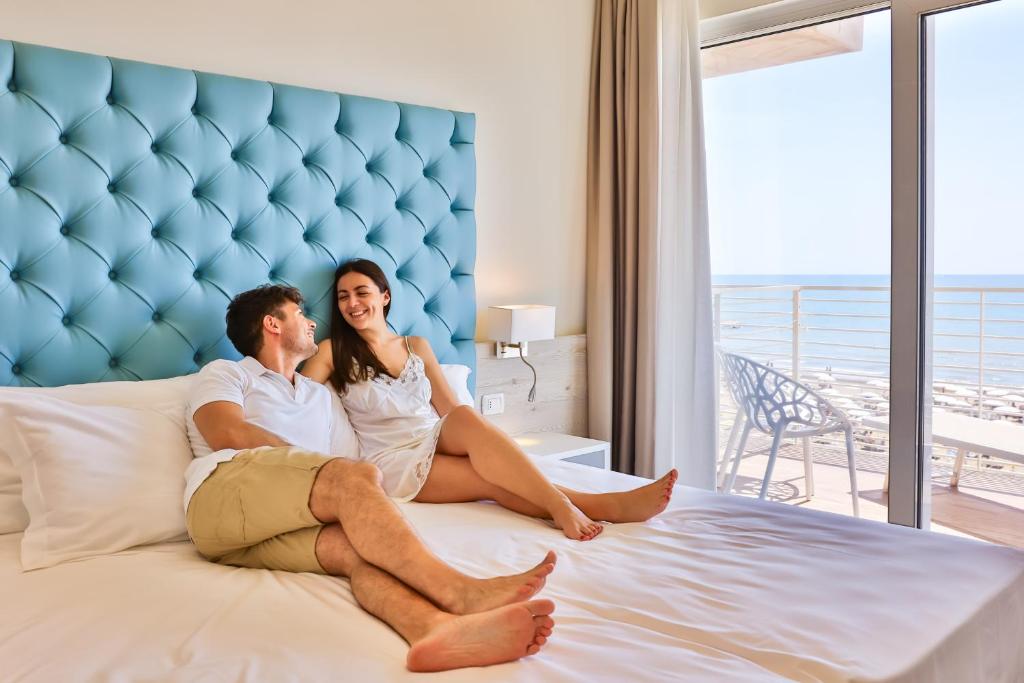 Postel nebo postele na pokoji v ubytování Hotel Ariston