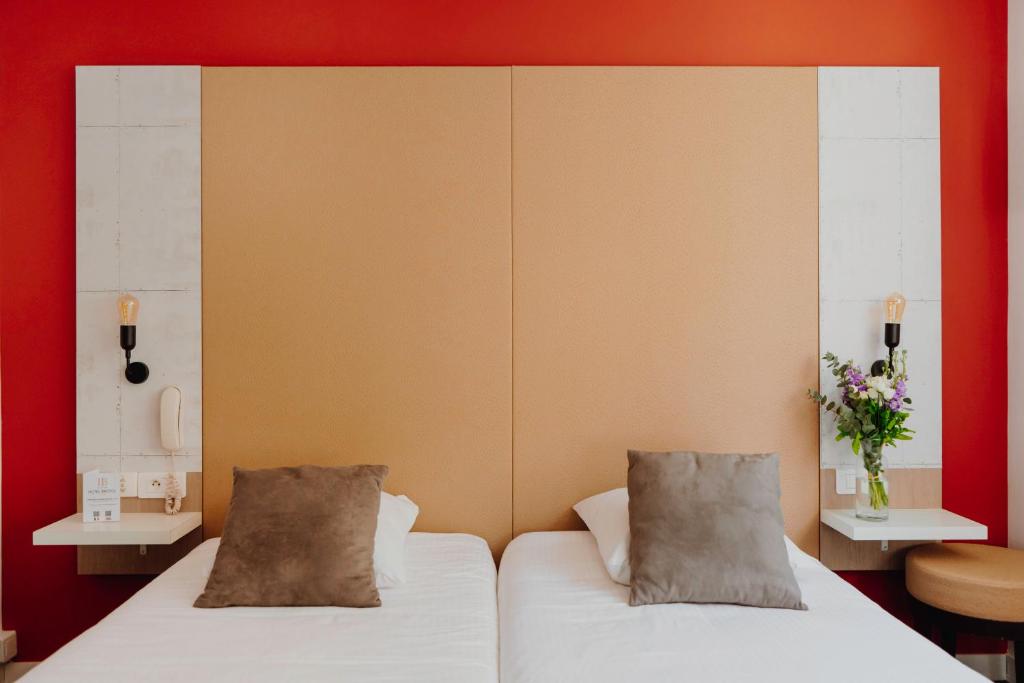 Postel nebo postele na pokoji v ubytování L'Hôtel Bristol