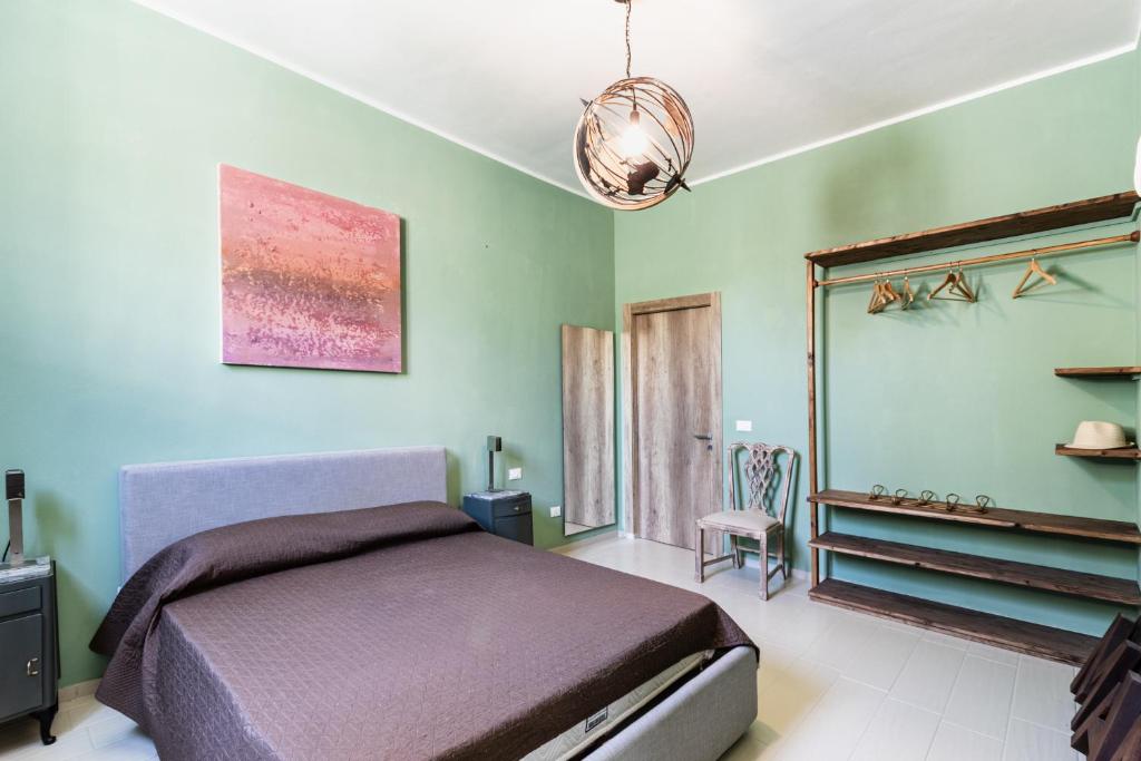 Postel nebo postele na pokoji v ubytování Agriturismo Val Di Noto