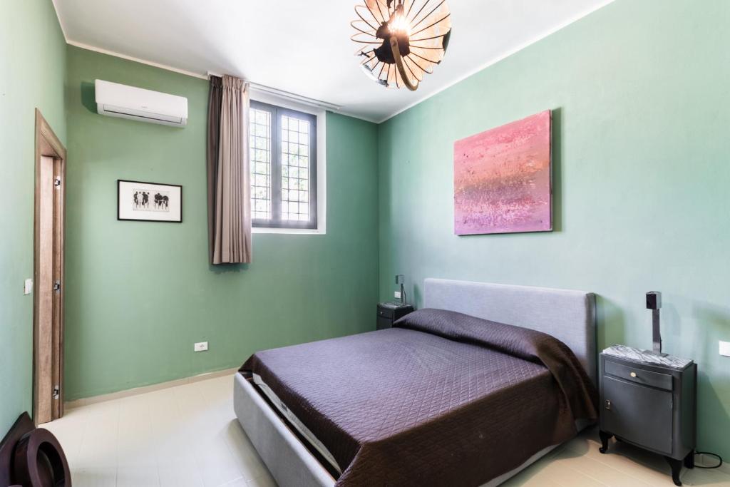 Postel nebo postele na pokoji v ubytování Agriturismo Val Di Noto
