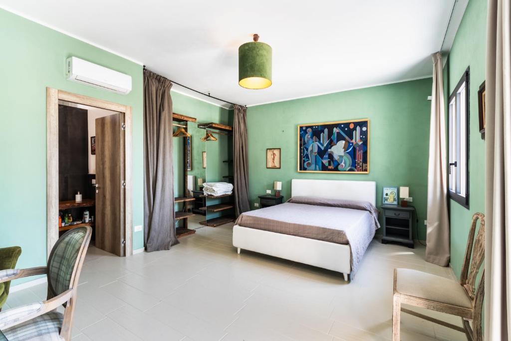 Postel nebo postele na pokoji v ubytování Agriturismo Val Di Noto