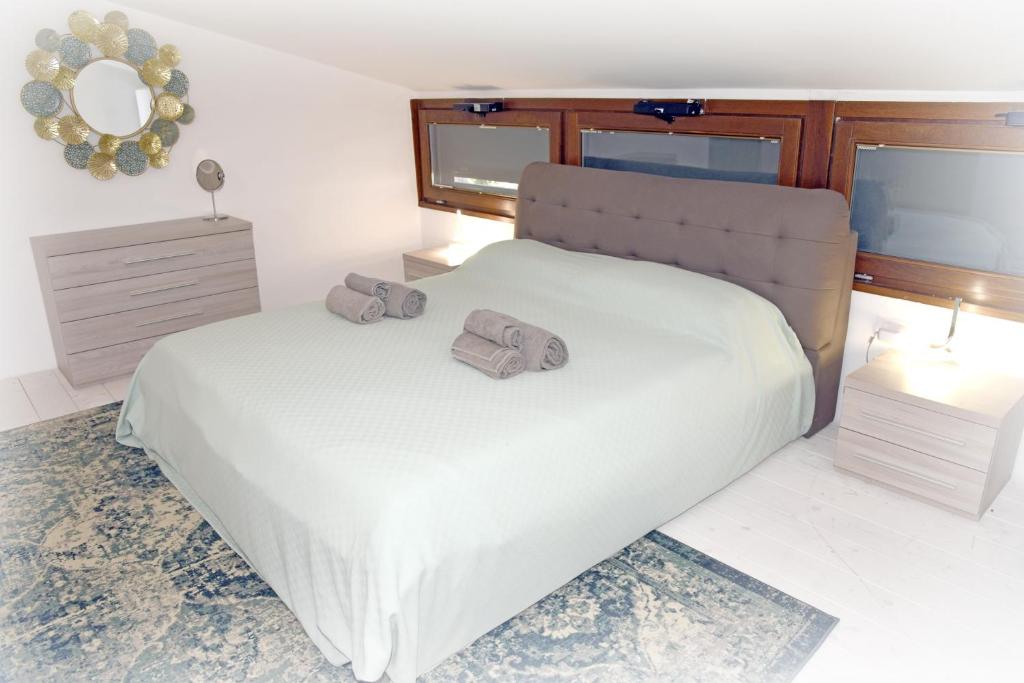 Postel nebo postele na pokoji v ubytování Agriturismo La Pecora Nera