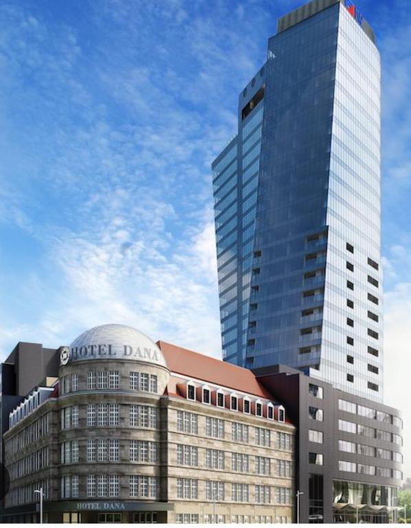 a tall building with a sign on top of it at Na Hanzie in Szczecin