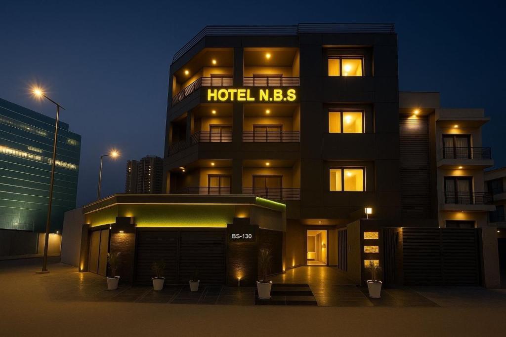 a hotel mews building with a hotel msg sign on it at Hotel Noida Business Suites in Okhla