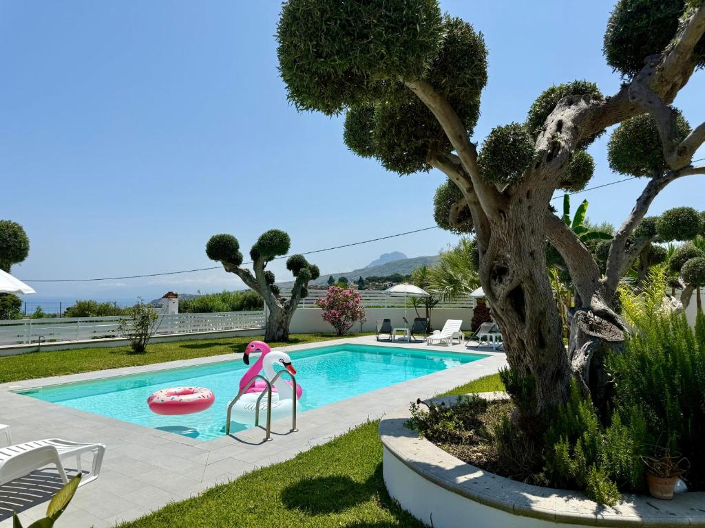 a swimming pool with a pool slide and a pool noodle in a yard at Villa GioEle - Pool & Relax in Mandra Capreria