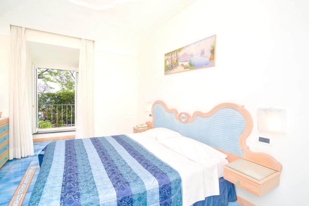 Cama o camas de una habitación en Albergo Italia - Beach Hotel