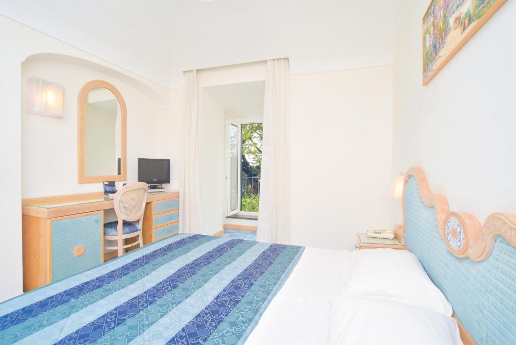 Cama o camas de una habitación en Albergo Italia - Beach Hotel