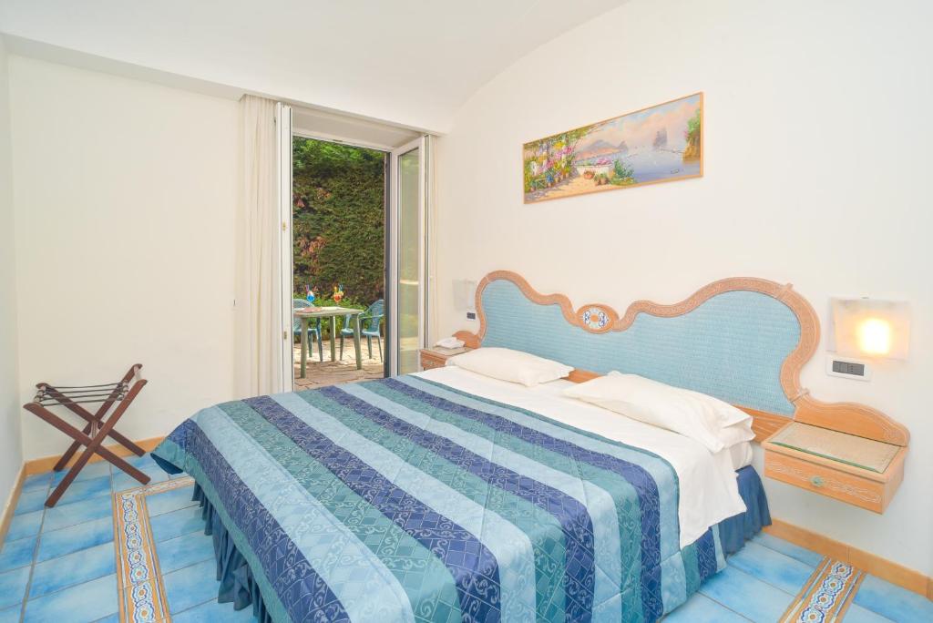 Cama o camas de una habitación en Albergo Italia - Beach Hotel