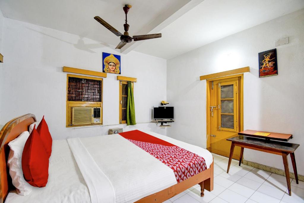 Postel nebo postele na pokoji v ubytování HOTEL O Upasana