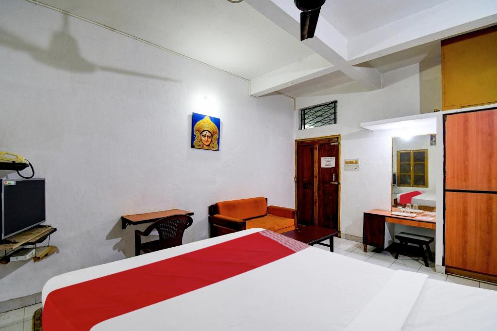Postel nebo postele na pokoji v ubytování HOTEL O Upasana