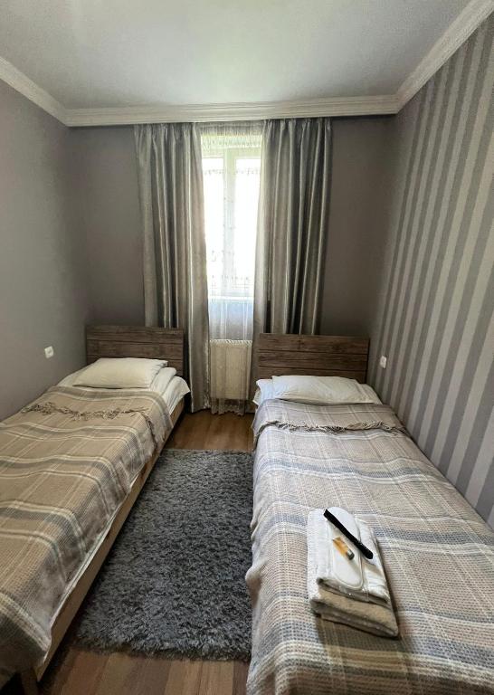 Ένα ή περισσότερα κρεβάτια σε δωμάτιο στο Guest house chavchavadze N23