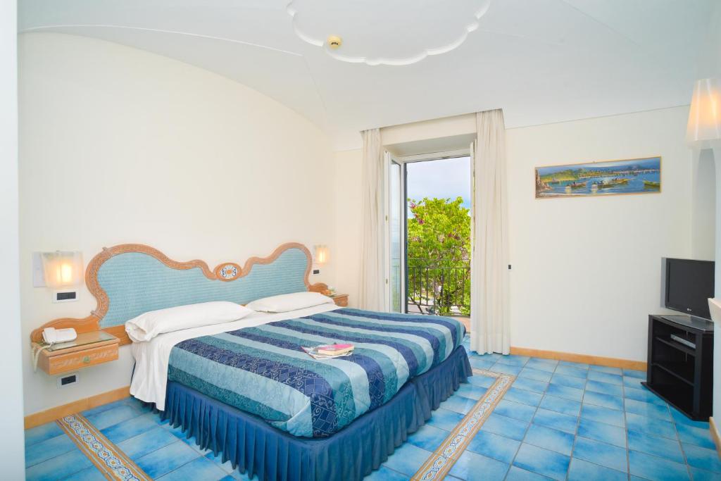 Cama o camas de una habitación en Albergo Italia - Beach Hotel