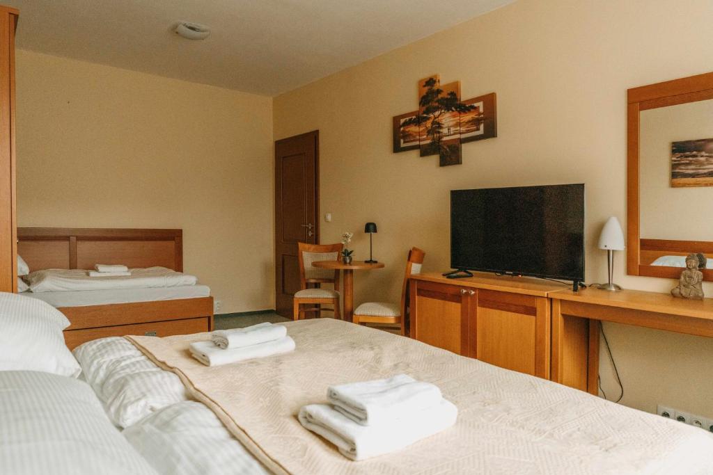 Postel nebo postele na pokoji v ubytování Rezidencia Edenium