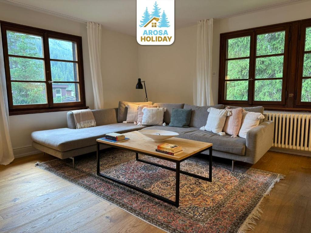Posezení v ubytování Chalet Pradella by Arosa Holiday