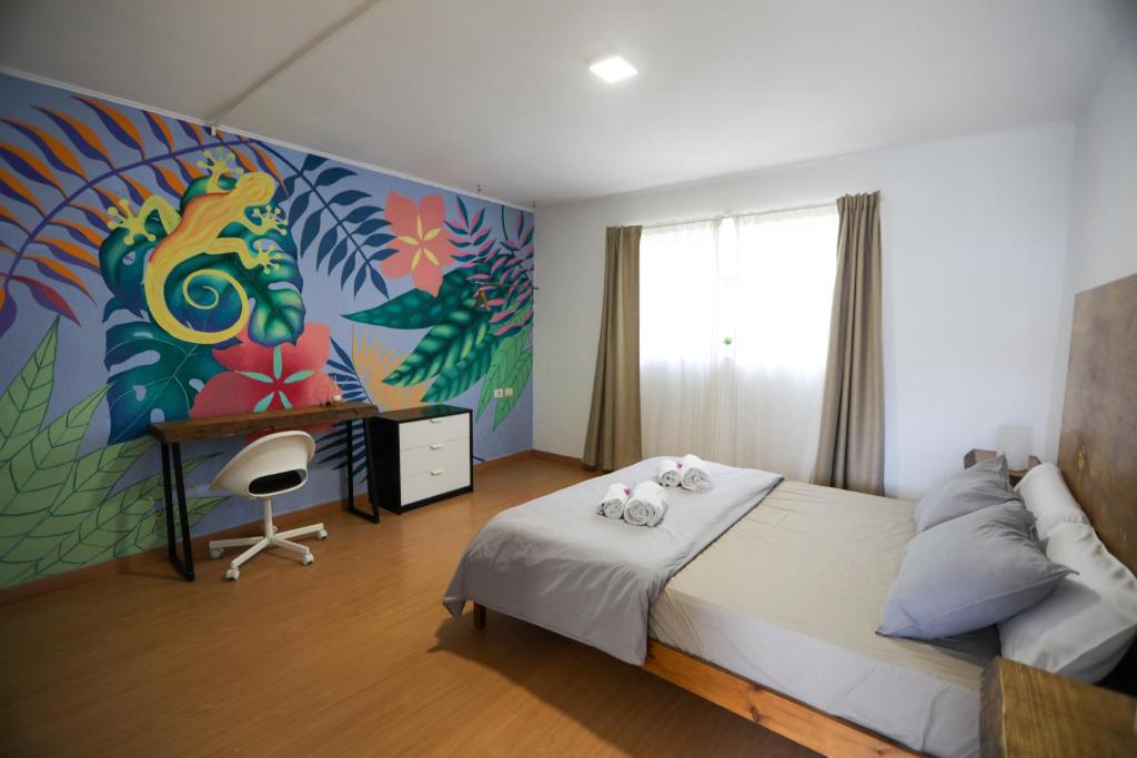 A bed or beds in a room at The Tree House Tenerife
