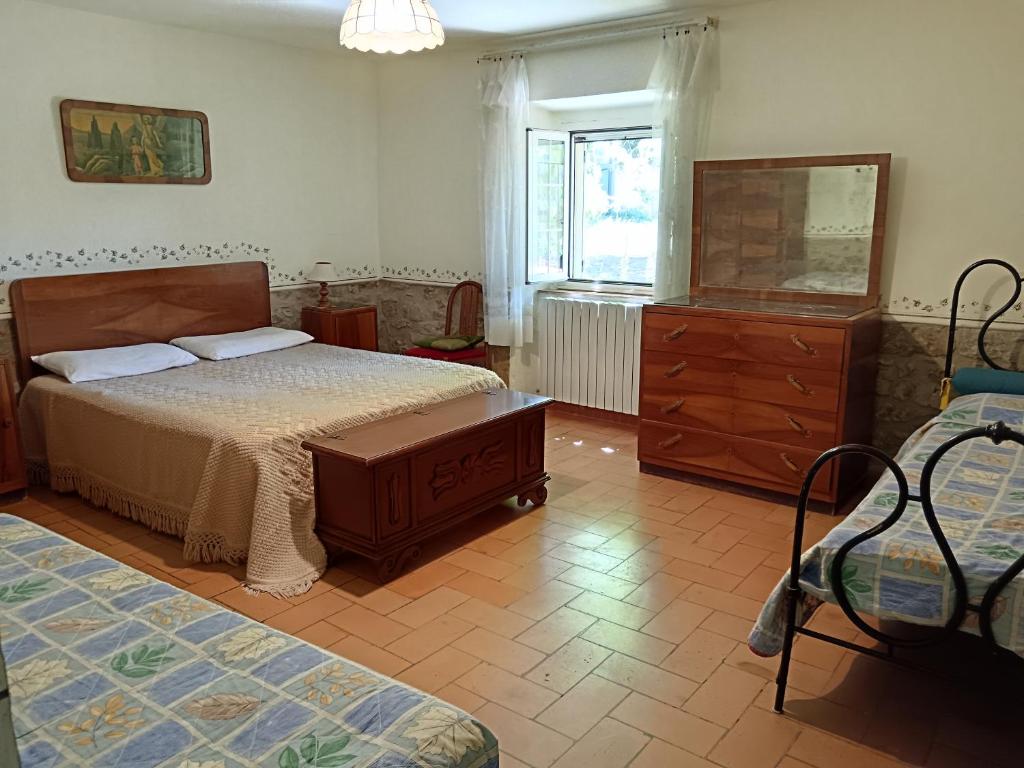 Postel nebo postele na pokoji v ubytování Podere Le Chiuse