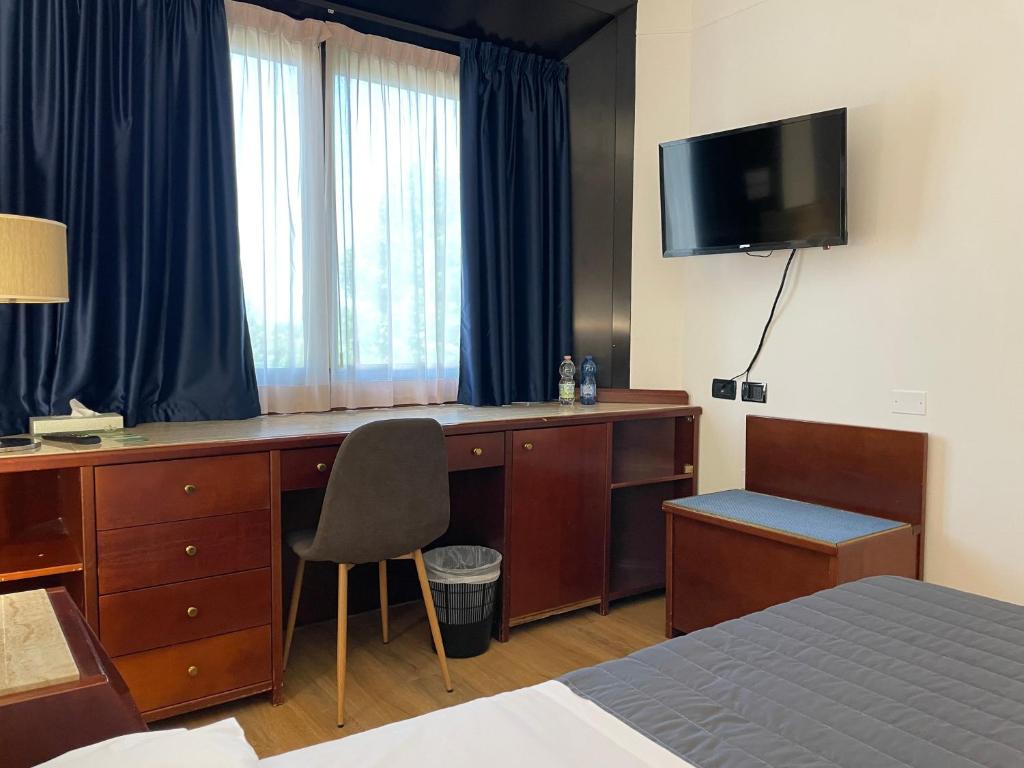 TV a/nebo společenská místnost v ubytování Hotel Sirena - B&B