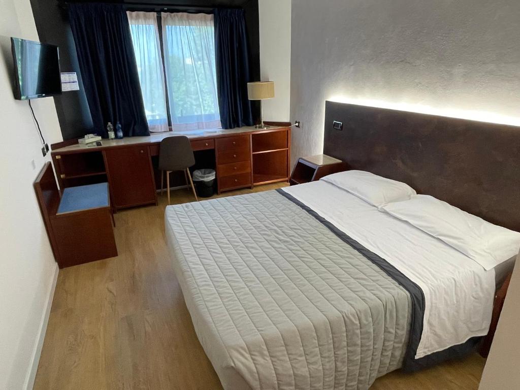 Postel nebo postele na pokoji v ubytování Hotel Sirena - B&B