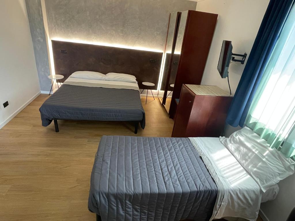 Postel nebo postele na pokoji v ubytování Hotel Sirena - B&B