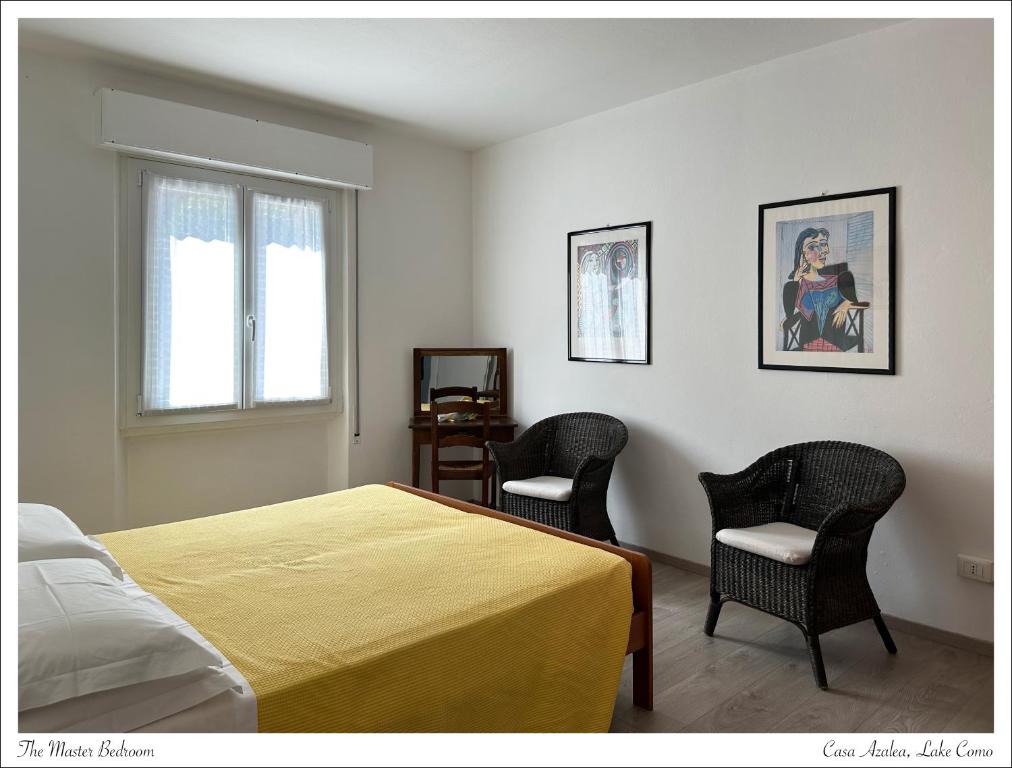 Postel nebo postele na pokoji v ubytování Casa Azalea, vista lago e giardino