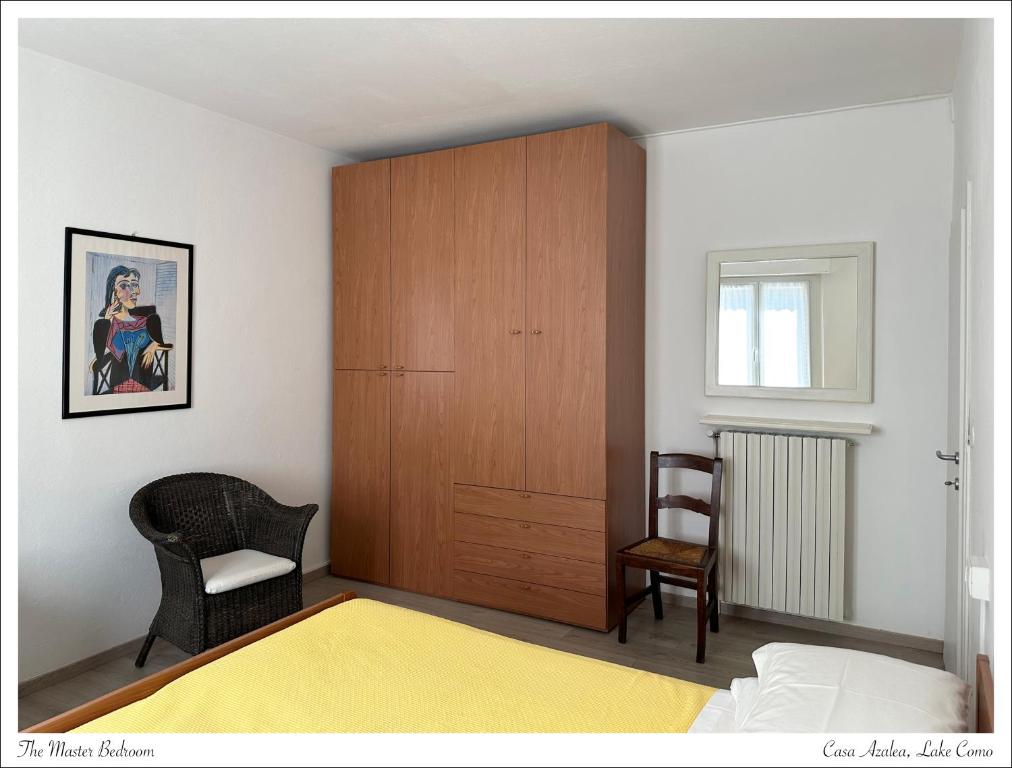 Postel nebo postele na pokoji v ubytování Casa Azalea, vista lago e giardino