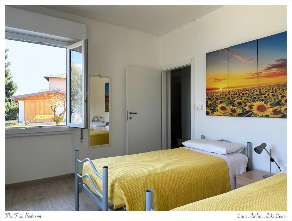 Postel nebo postele na pokoji v ubytování Casa Azalea, vista lago e giardino