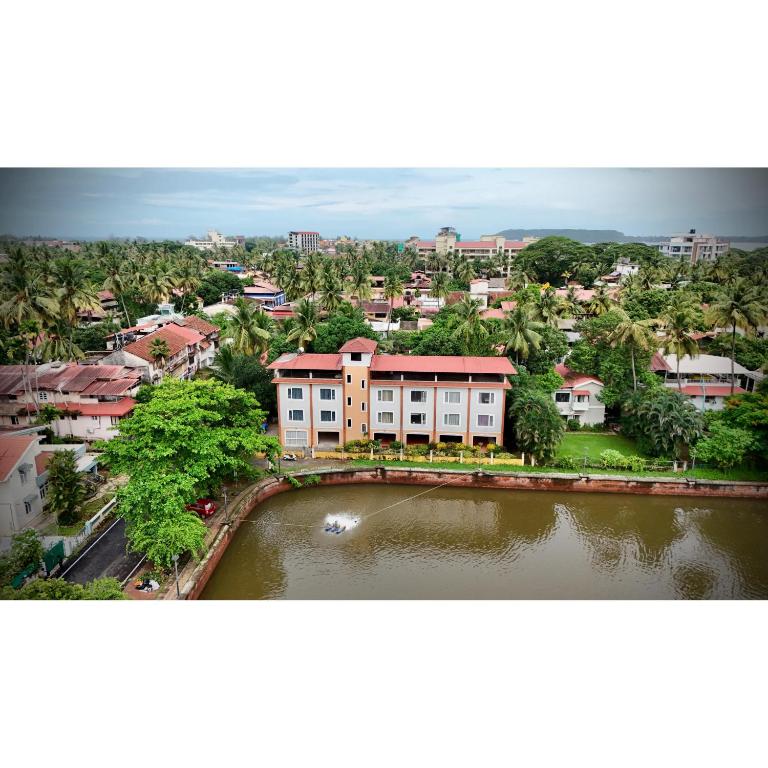 an overhead view of a city with a building and a river at Casa Laguna Lakefront in Panaji